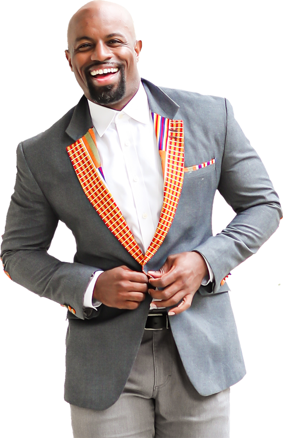 Justin Jones-Fosu, founder of Work Meaningful, smiling as he buttons up his gray blazer with African patterned embellishments on the lapels and pocket